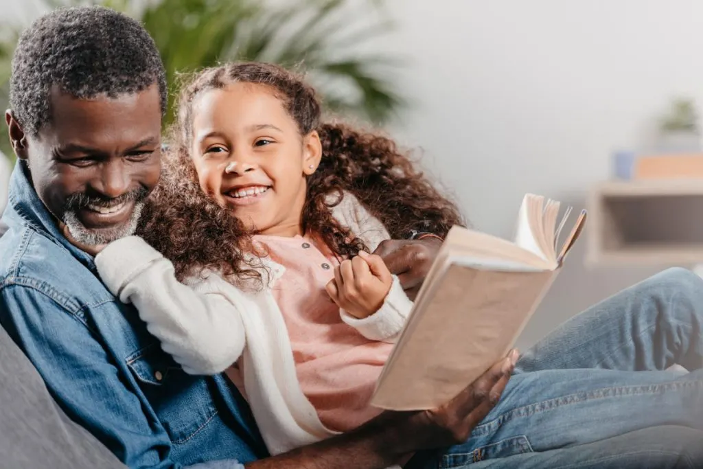 authoritive dad and daughter read together