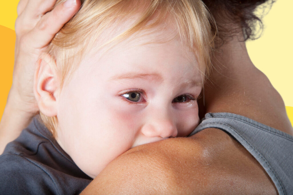 kindergartener cries on mom shoulder coping skills for elementary students
