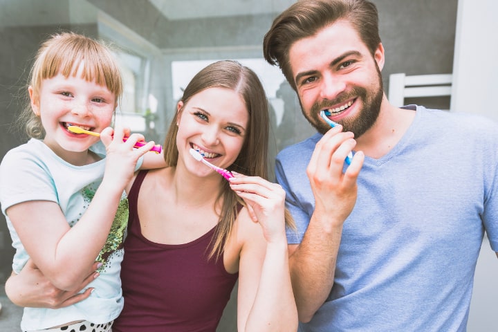 The whole family brush their teeth - best way on how to get kids to brush teeth