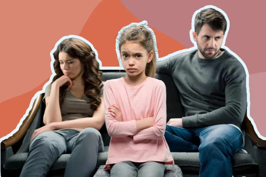 Father, mother and daughter sitting on a couch, ignoring each other