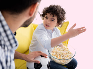 boy angry at dad over popcorn