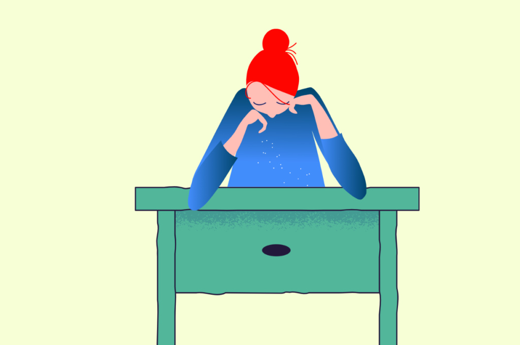 anxious mom sits at desk