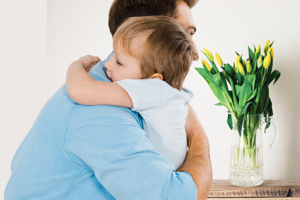 boy hugs dad in insecure attachment styles