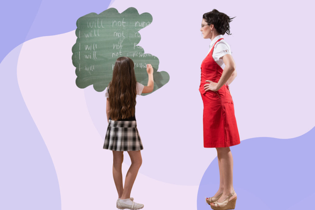 A teacher standing next to a schoolgirl who is writing lines on a blackboard.