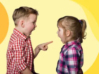 A young boy and girl face each other shouting.
