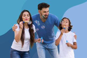 family blows bubbles together